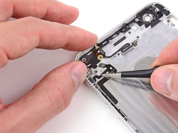 Image 2/3: Peel with care. The cable is secured to the rear case with mild adhesive.