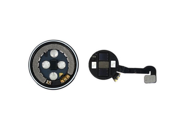 Image 3/3: With the sensor assembly removed, we spy what we assume is the inductive charging coil left behind in the cover.