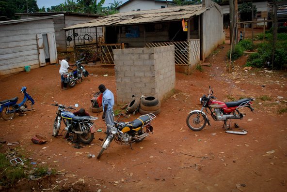 Motorcycle roadside repair in Cameroon