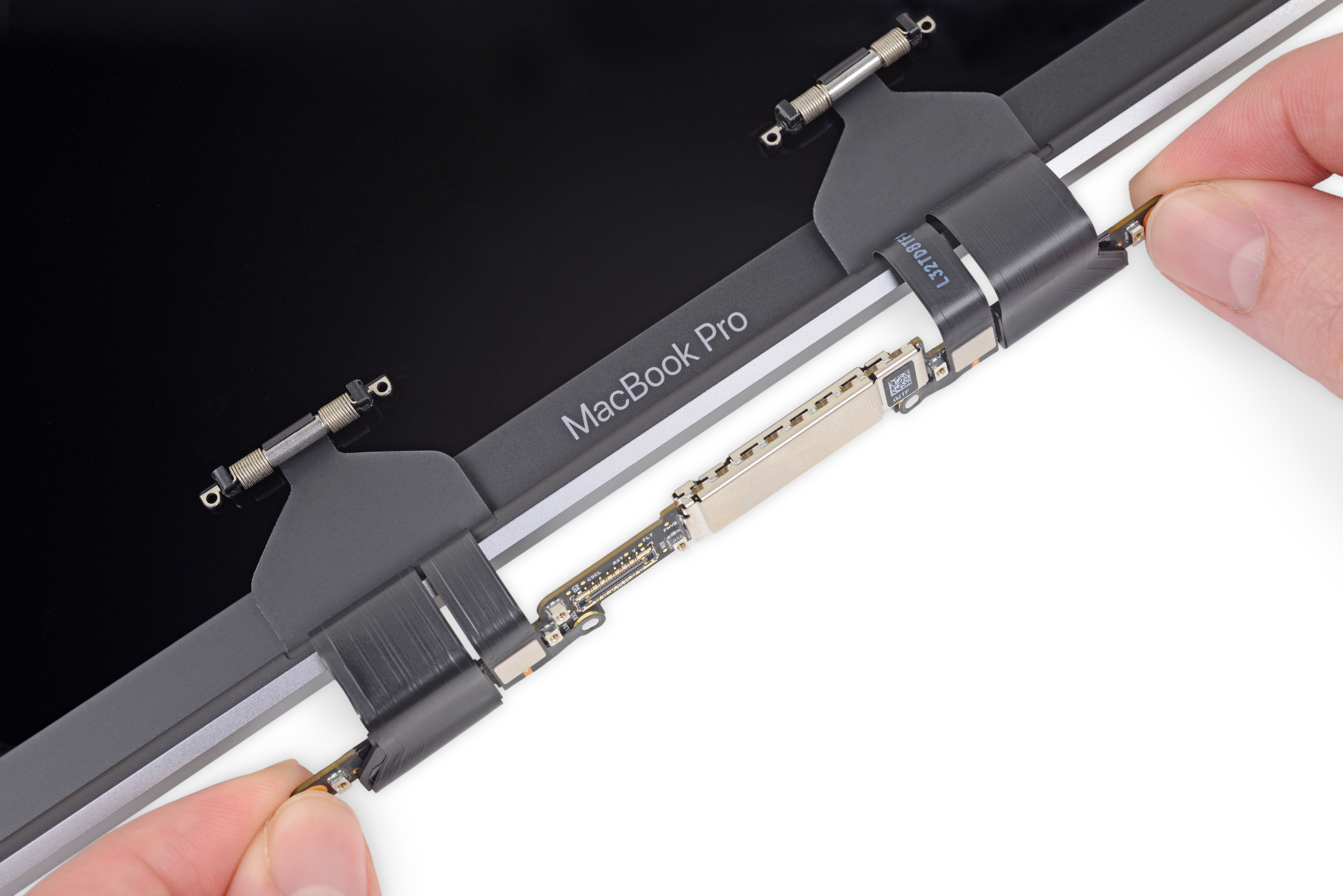 The display control board in the MacBook Pro 2016, and the display cables wrapped around it