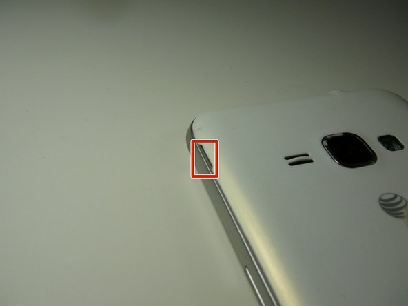 Starting from the indent, use a finger nail or guitar pick to separate the back from the body of the phone.