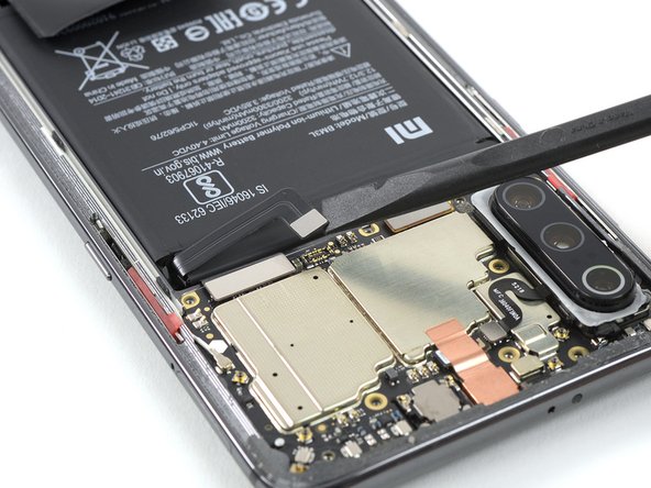 Use a spudger to pry up and disconnect the battery flex cable.