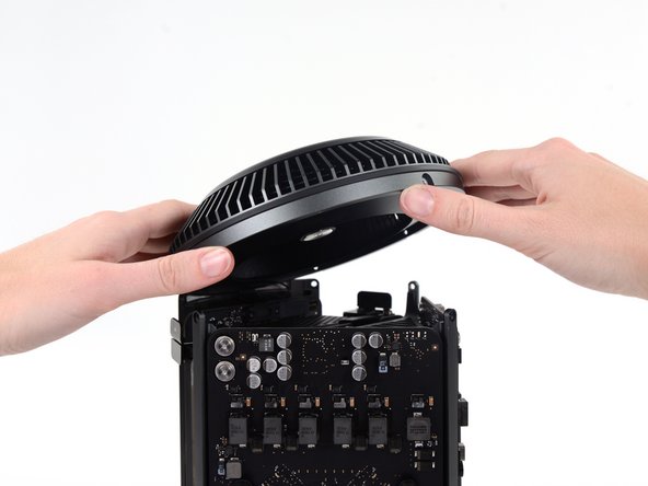 Image 2/2: Do not try to remove the fan assembly yet, as it is still attached by two cables.