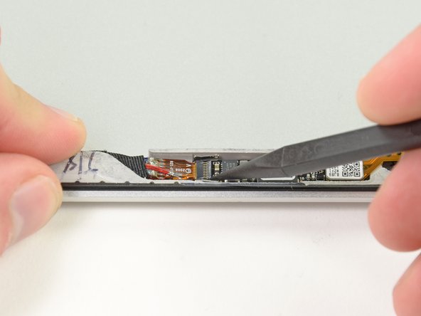 Image 1/2: Be sure you are prying up on the hinged retaining flap, '''not''' the socket itself.