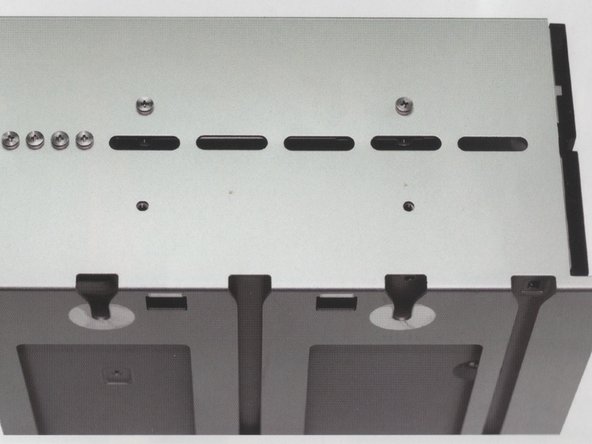 Image 1/1: Note: There are 4 screws provided by Apple already on the back side of the drive carrier. Remove and use them to fasten the drive to the carrier.