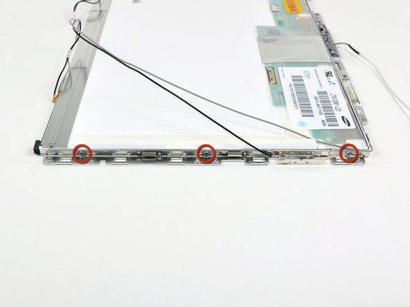 Remove the three 3.1 mm Phillips screws along the right edge of the display.