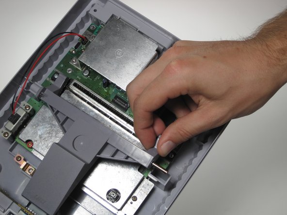 repairing a game console on iFixit repair guide