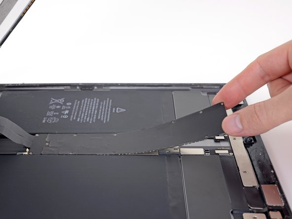 Peel the EMI shield up from the logic board.