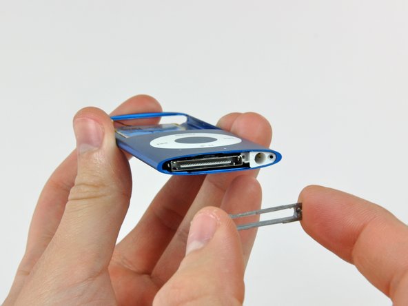 Image 2/2: The dock bezel is very thin cast aluminum. To avoid breaking it, do not excessively flex it during removal.