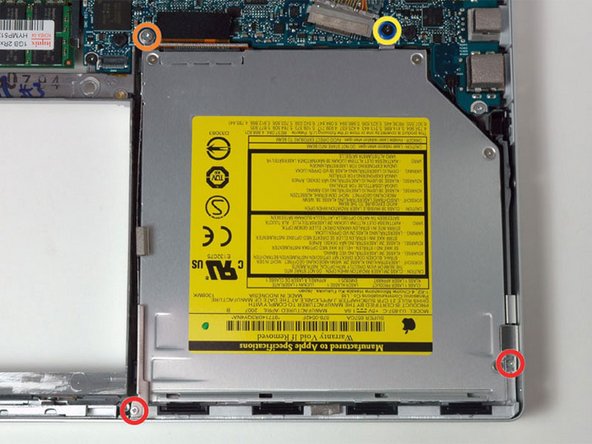 Image 1/1: Two 3.3 mm silver Phillips screws on either side of the SuperDrive.