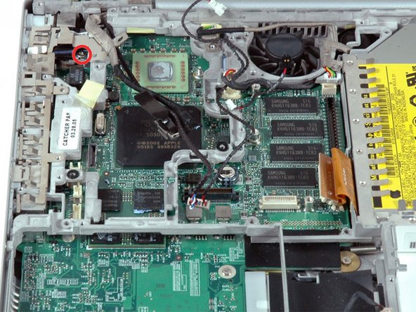 Image 1/1: Some computers may have two Phillips screws securing the RJ-11 board to the metal framework.