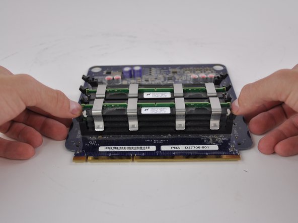 Image 1/3: To insert a new RAM stick, place the RAM into the slot with the correct orientation and push on the stick using both hands until the ejectors are clicked into place.