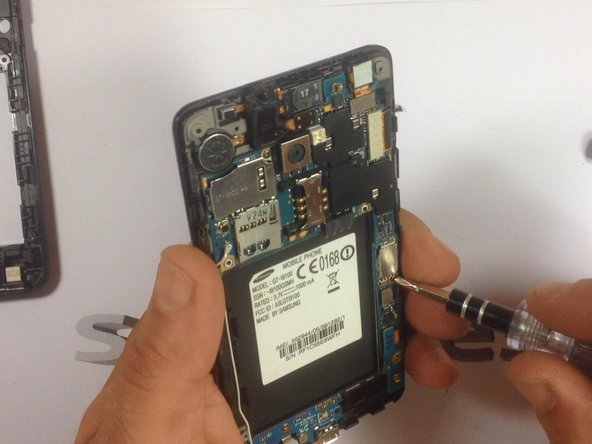 The mother board is held by 2x screws. Remove them.