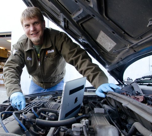 Using the repair manual on the iPhone app to repair a car