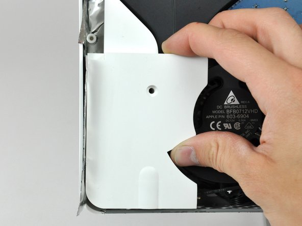 Image 2/2: Pull the left speaker out of the rear case.