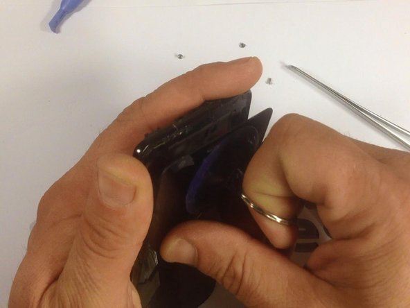 Now, use a suction tool to remove the screen from it's housing. Be careful when doing this, to prevent possible injury.