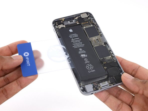 Prepare an iOpener and apply it to the back of the rear case, directly over the battery. Alternatively, you can apply heat using a heat gun or  hair dryer.