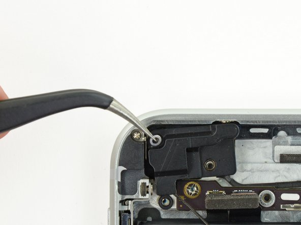 Image 2/2: During reassembly, make sure to place the small washer in the top left corner of the antenna assembly.