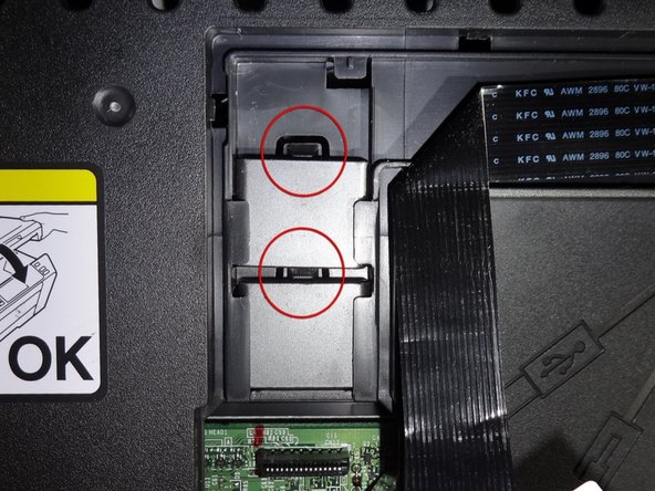 *note for reassembly: the ribbon cable placement holders can be removed to make it easier to re-thread the ribbon cable by gently pushing down the tabs with the spudger