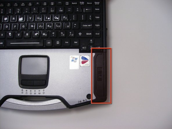 Locate the door for the hard drive on the right side of the laptop