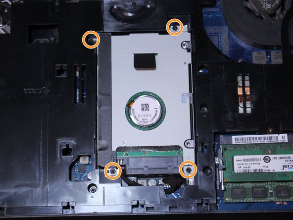 Remove all 4 screws holding the hard drive in with the screwdriver.