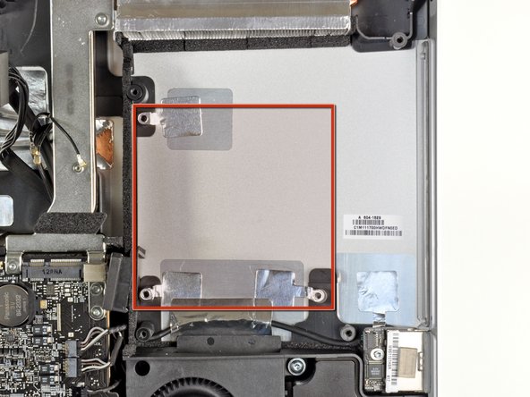 Image 3/3: The area shaded in red in the third picture is presumably where the [link|http://store.apple.com/us/configure/MC812LL/A?mco=MjIwNTQ2NTA#hardware|optional SSD] is housed. The three mounting points within the shaded area have nothing attached to them in our machine, since this option is only available on 2.7 GHz 21.5" iMacs.