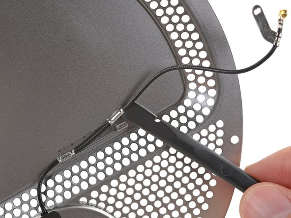 To reconnect the cable, use tweezers to position it carefully over its socket on the logic board, and then press it straight down until it snaps into place.