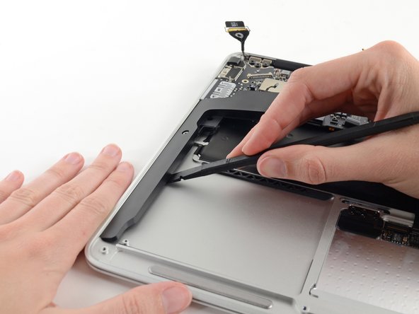 Image 2/3: Remove the right speaker from the upper case.