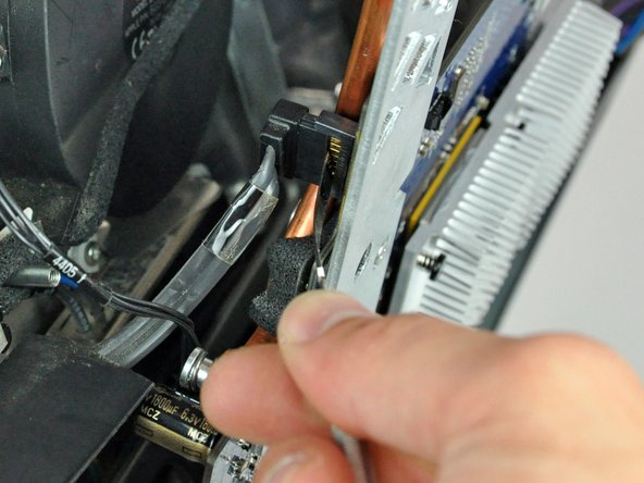 Image 2/2: Disconnect the SATA cable from the logic board.