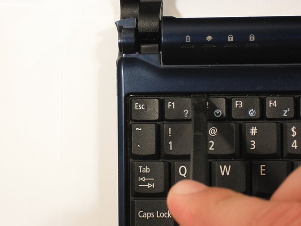 Start with the spudger pointing towards the display and pry up to push each tab off the keyboard.