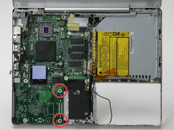 Image 1/1: When reassembling, take note of the plastic piece immediately to the right of the screws.  Make sure you do not neglect to put it in place before screwing down the logic board.
