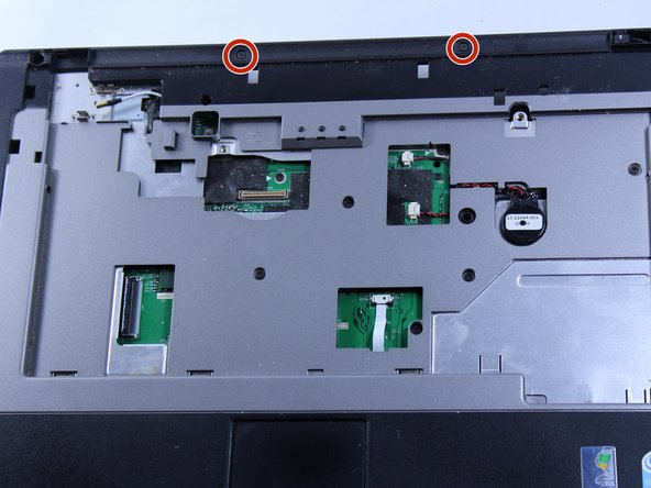 Turn the computer over and remove the two 4 mm screws that are located just below where the screen should be.