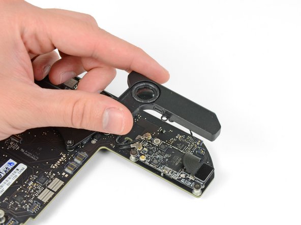 Image 2/2: Lift and remove the speaker away from the logic board.