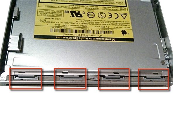 Image 3/3: '''Reassembly Tip:''' Press down firmly on the tip of the top case above the location of each clip until you hear a ''snap'' to reseat them in their slots.