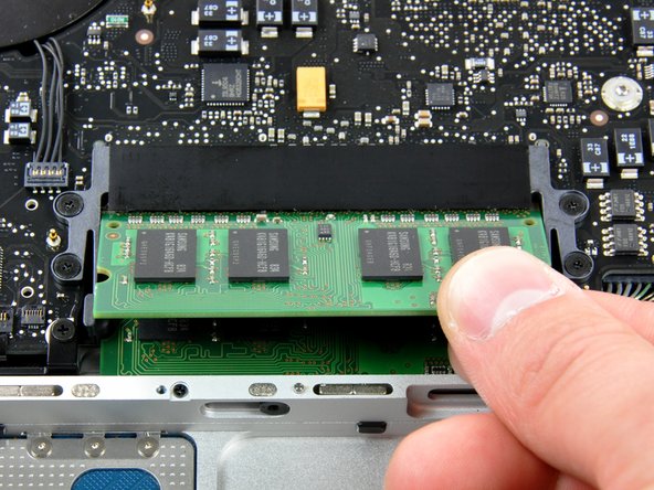 Image 1/1: Repeat this process if a second RAM chip is installed.