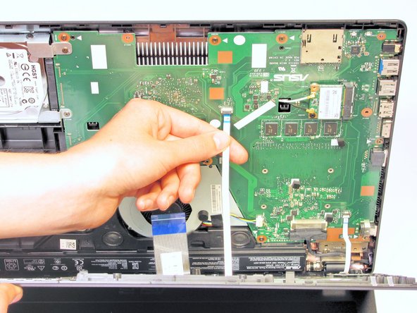 Remove each ribbon by flipping the small white plastic flap up and gently pulling on the ribbon.