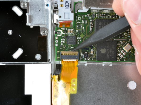 Image 1/1: The retaining clip is hinged about the end nearest the battery.