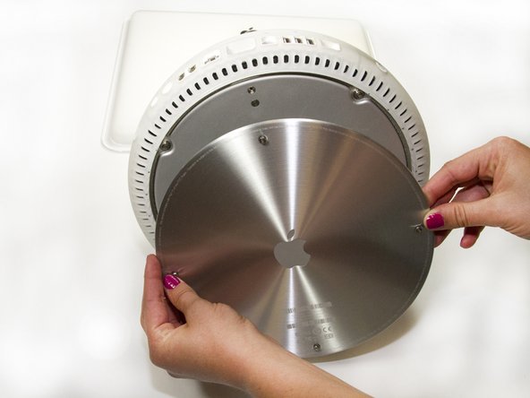 Image 1/1: The four screws do not completely separate from the metal plate.