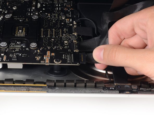 Image 2/2: Lift the display up enough to have easy access to the connector, but not so much that you stretch the cables and stress their connections (about 8").