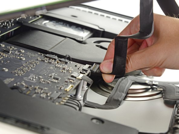 Image 2/2: Lift the display up enough to have easy access to the connector, but not so much that you stretch the cables and stress their connections (about 8").