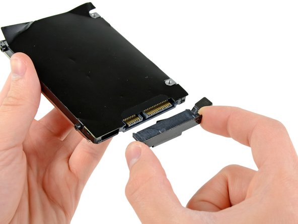 Image 2/2: Remove the hard drive cable by pulling its connector straight away from the hard drive.