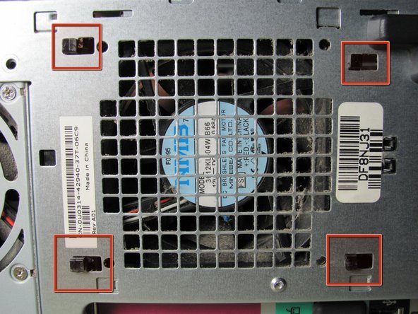 Image 1/1: While holding the release clip down, look on the outside of the case where the fan lies.