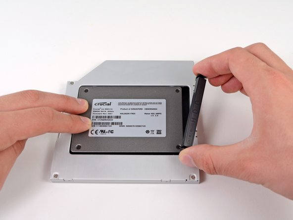 Image 1/2: Reconnect any cables you have removed from the original optical drive onto the optical bay enclosure.