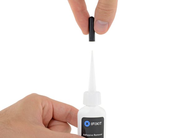 Pull off the black rubber stopper from your bottle of adhesive remover.