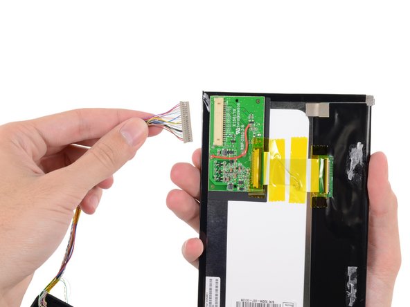 Image 3/3: Disconnecting one cable from the display assembly allows us to completely remove it for further examination.