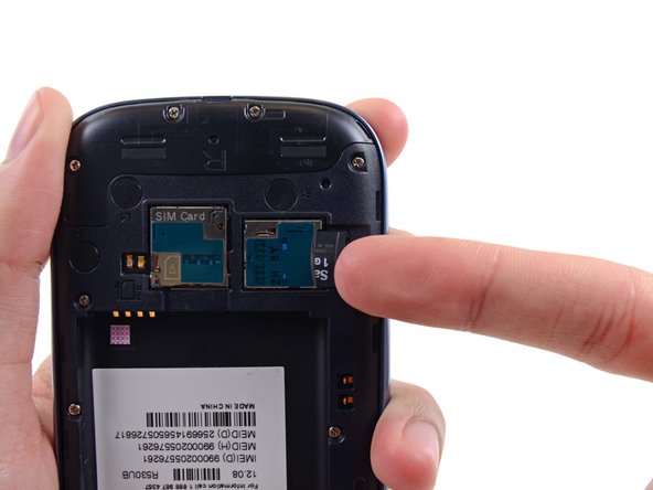 Image 3/3: For reassembly, push the microSD card into the slot until it clicks in place.