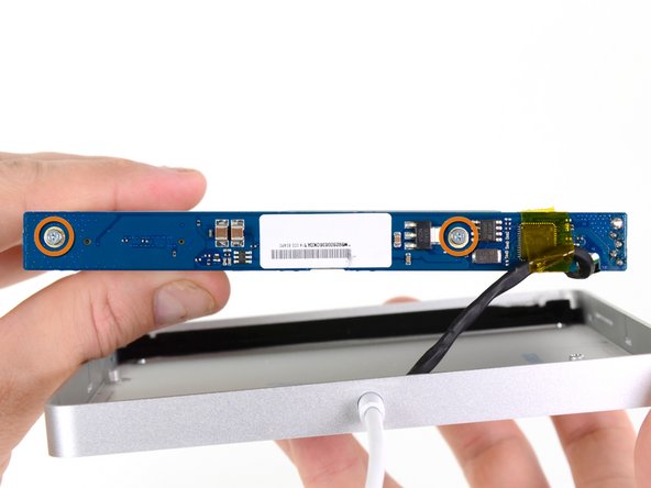 Image 1/1: two 3.8 mm #00 Phillips head screws.