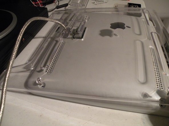 Image 2/3: Then lift the panel from the top of the display.