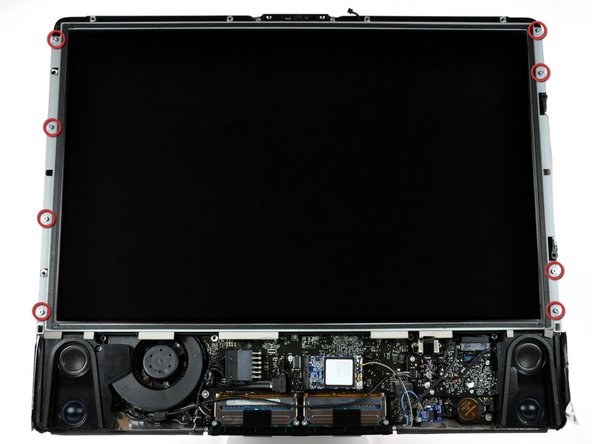 Remove the eight T8 Torx screws securing the display panel to the rear case.