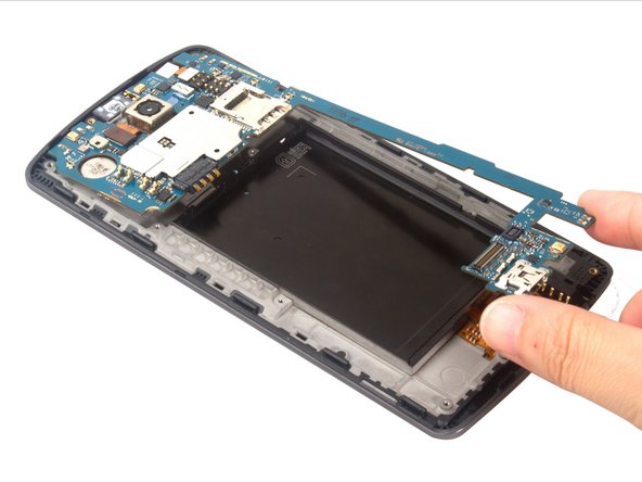 Release the digitizer and LCD connectors. The two cameras are held slightly in the frame. Carefully  remove the motherboard with cameras.